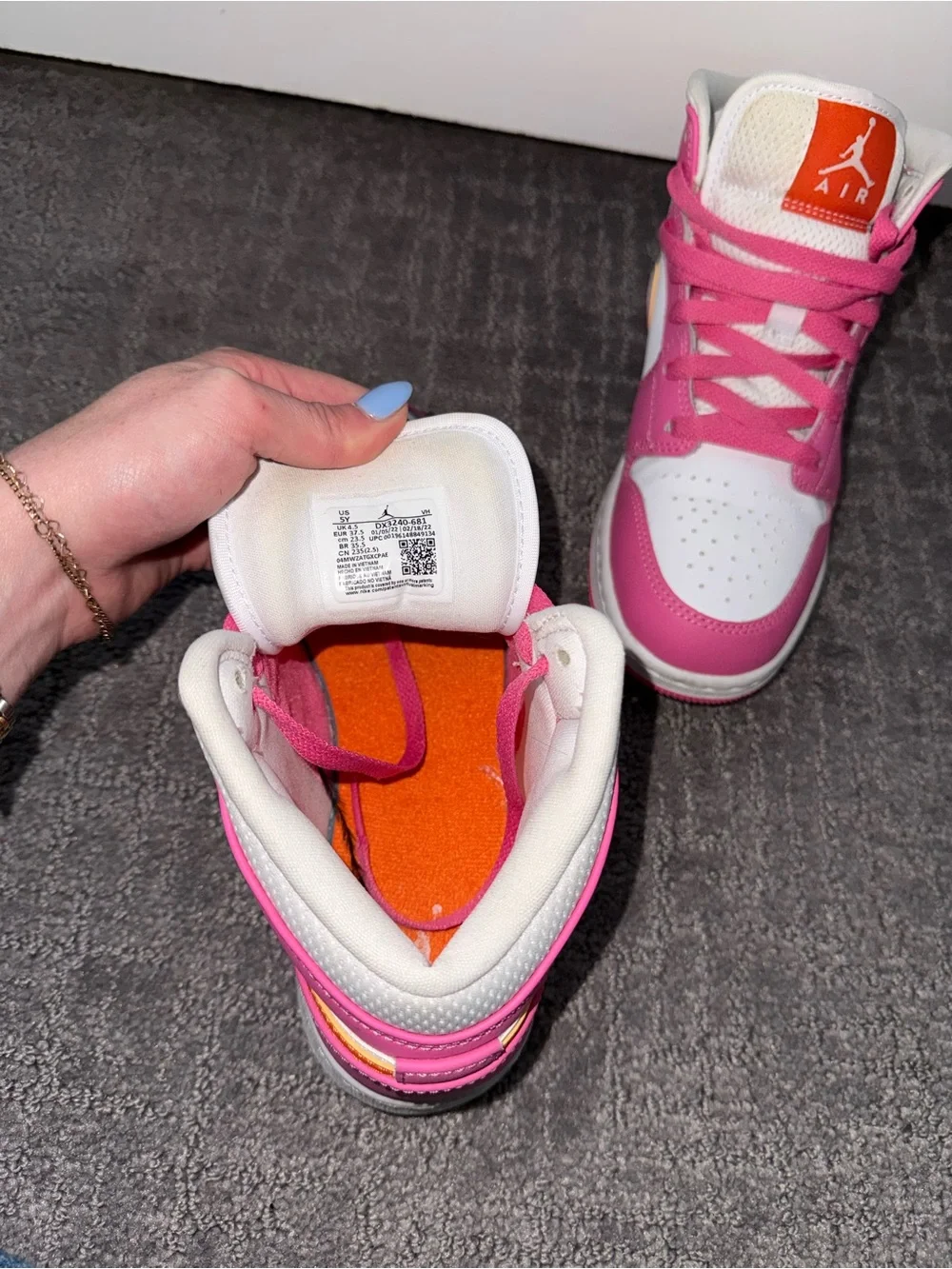 Jordan Pink and White High-Top Sneakers with Orange Tongue Logo